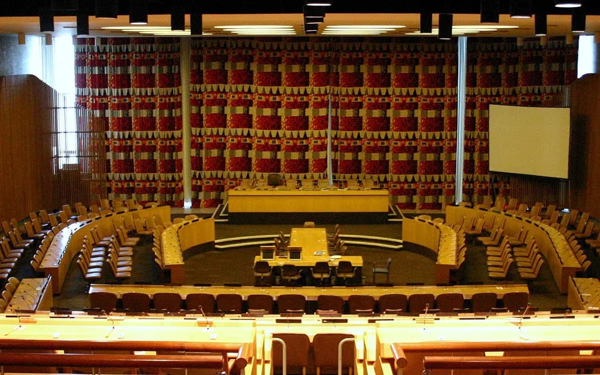 The UN Economic and Social Council chamber in New York, with tiered delegation seating around a central table