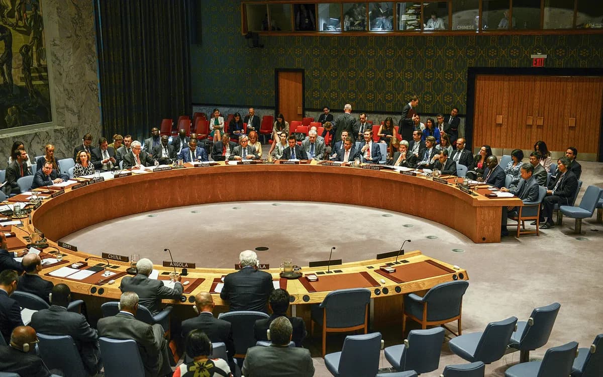 A meeting of the UN Security Council in New York: ambassadors seated around the horseshoe table with advisers behind them